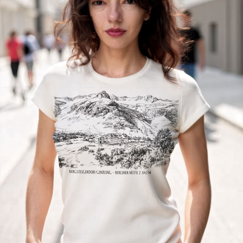 Woman wearing an ivory T-shirt with a monochrome mountain illustration