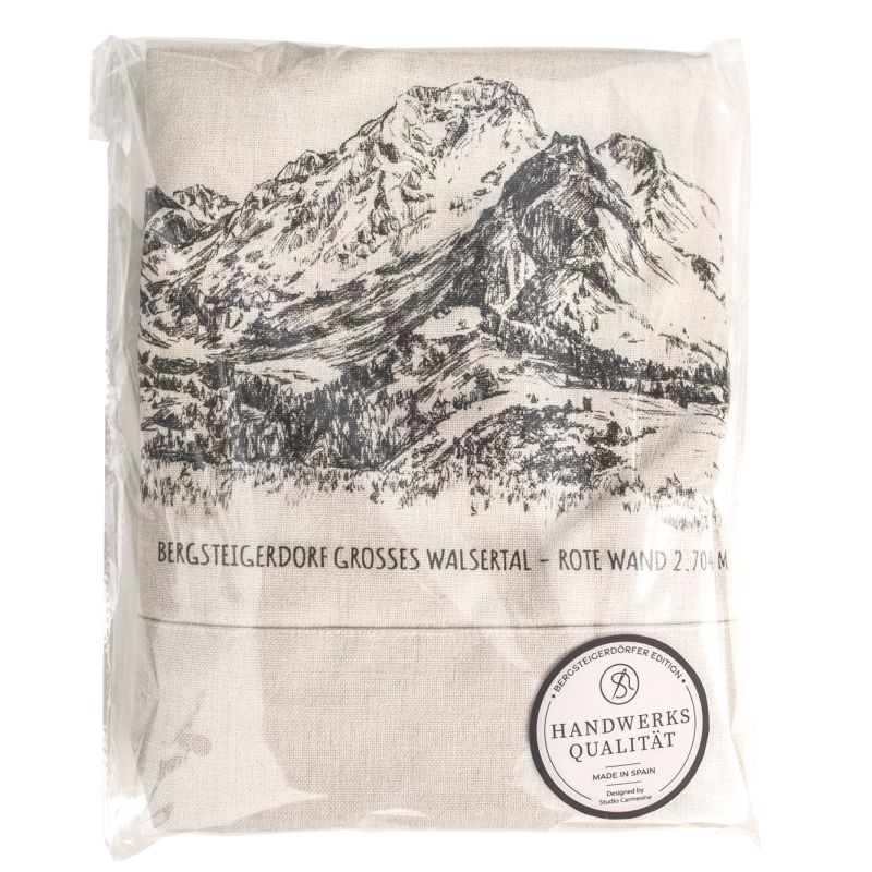Folded ivory T-shirt with mountain artwork and garment label