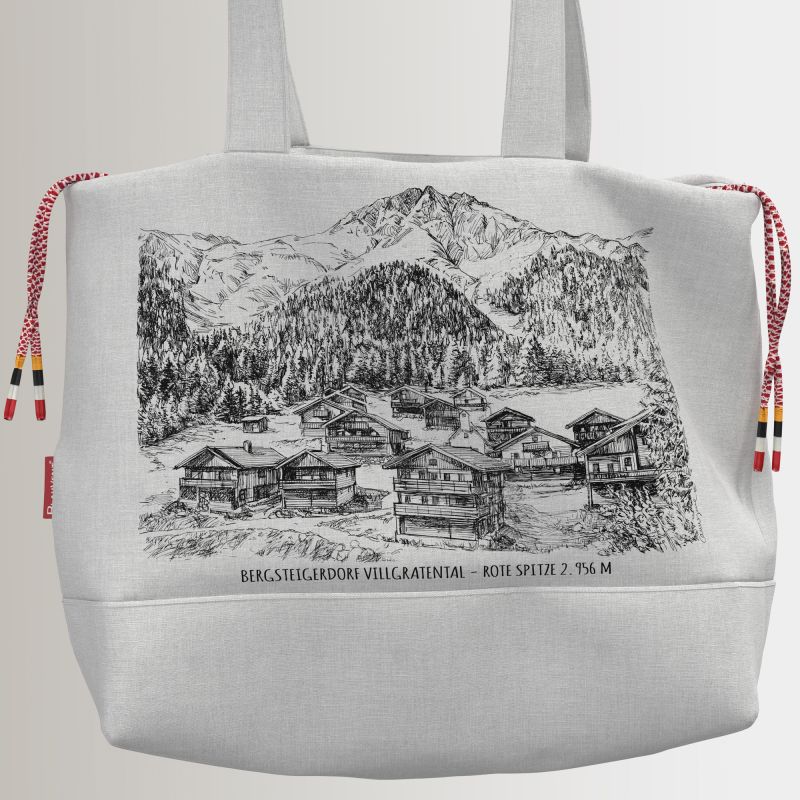 White shoulder bag featuring a village landscape print and coloured drawstrings