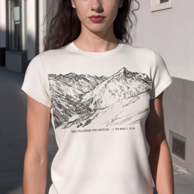 Woman wearing a white Alpine landscape T-shirt in an urban setting