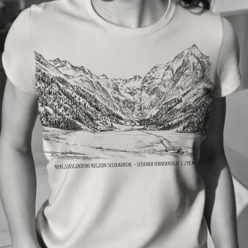 Black-and-white fashion photograph of a woman wearing an Alpine artwork T-shirt