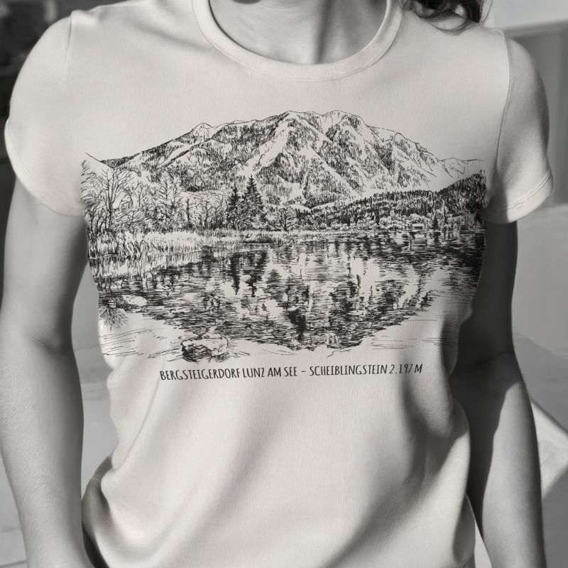 Black-and-white photograph of a woman wearing a printed mountain T-shirt