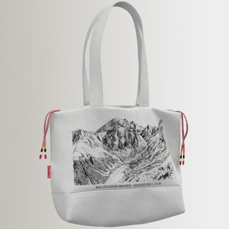 Light-coloured shoulder bag with printed mountain artwork and drawstring sides