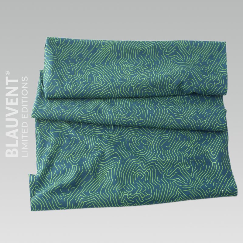 Folded turquoise and green printed neckwarmer with an intricate topographic contour-line design.