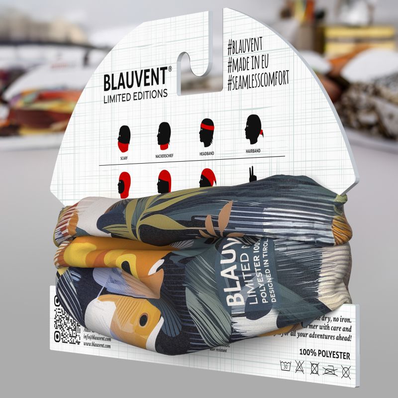BLAUVENT neckwarmer with tropical fish and leaf print displayed on retail packaging.